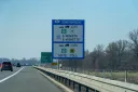 Czech Republic (Česká Republika) toll sign on the D1 motorway near Bohumín showing e-vignette/e-winieta requirement for vehicles up to 3.5t and Myto toll for vehicles over 3.5t, with distance signs to Praha, Brno and Ostrava